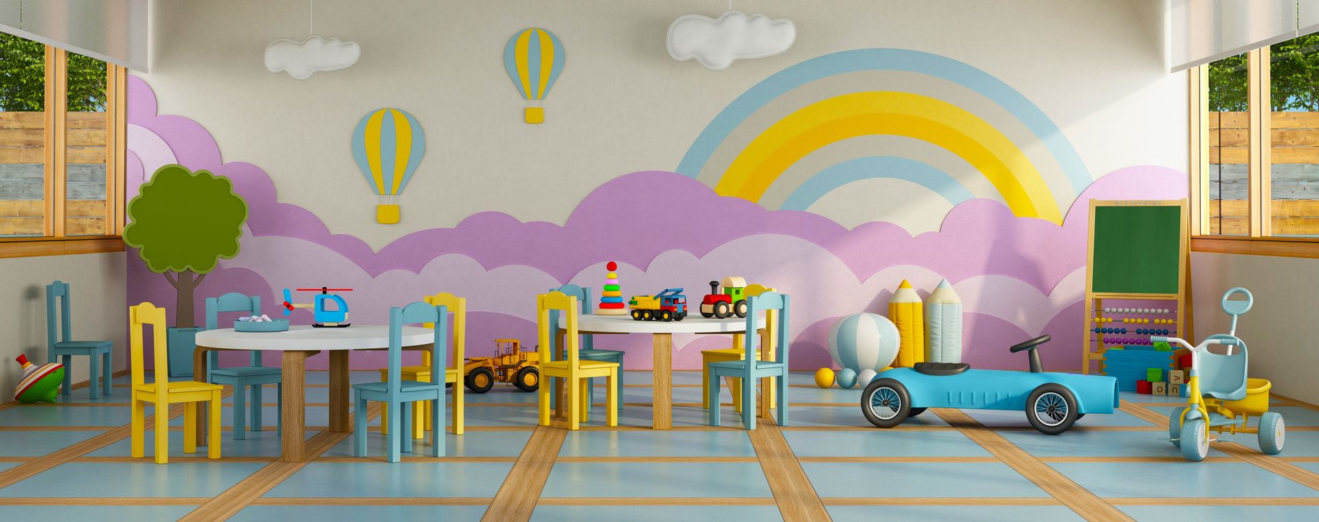 Bright colourful playroom with kids' tables, chairs, toys and a rainbow wall mural